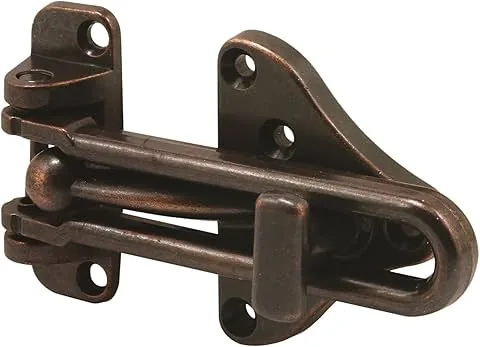 Defender seguridad U 11317 Barra de oscilação de protetor de porta com fechadura de alta segurança auxiliar, Classic acabamento em bronze, 1-Pack